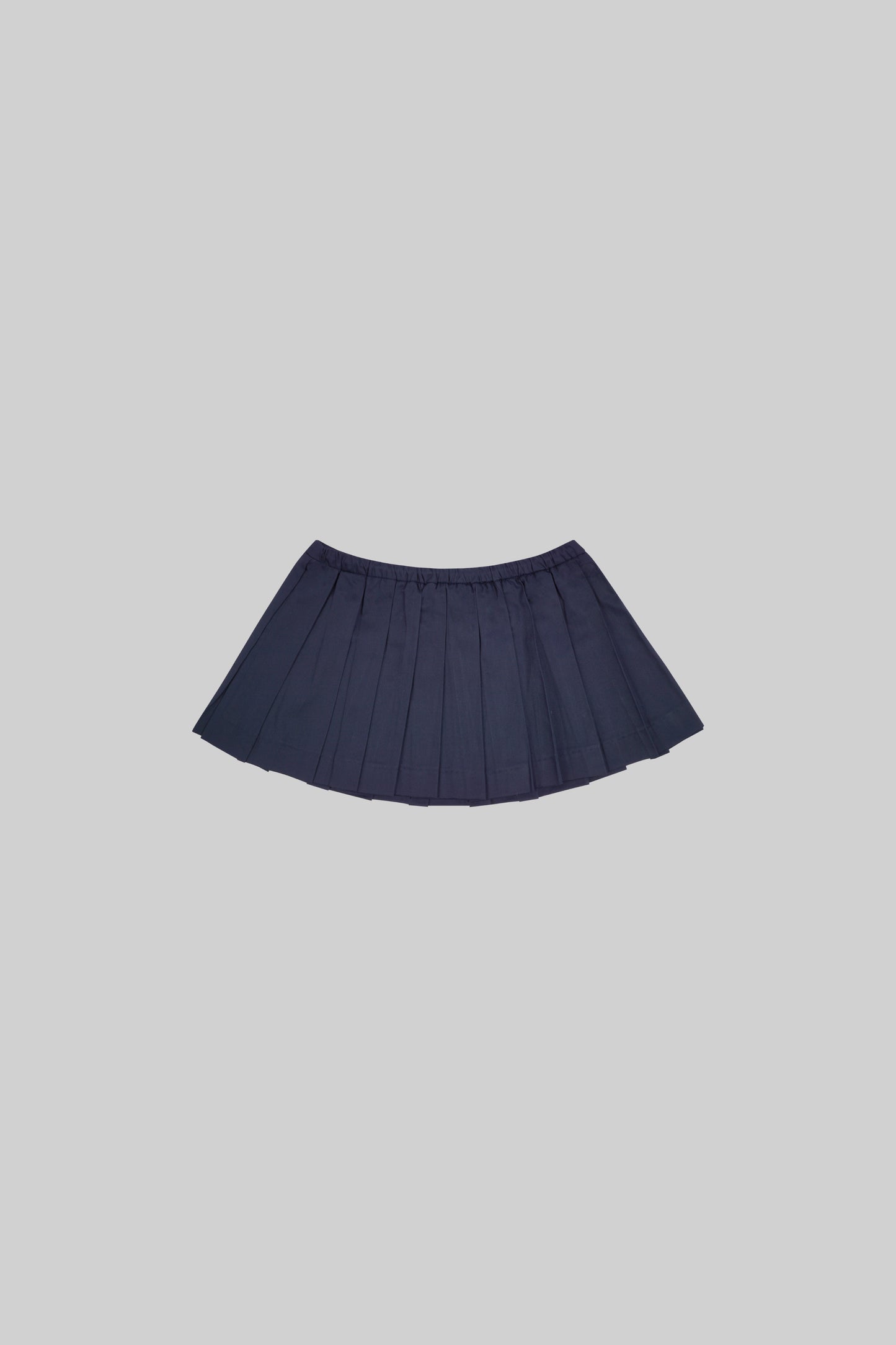 Bross Before HOS Boutique skirt with a stylish plate detail, shown in a close-up view highlighting the fabric and design features.