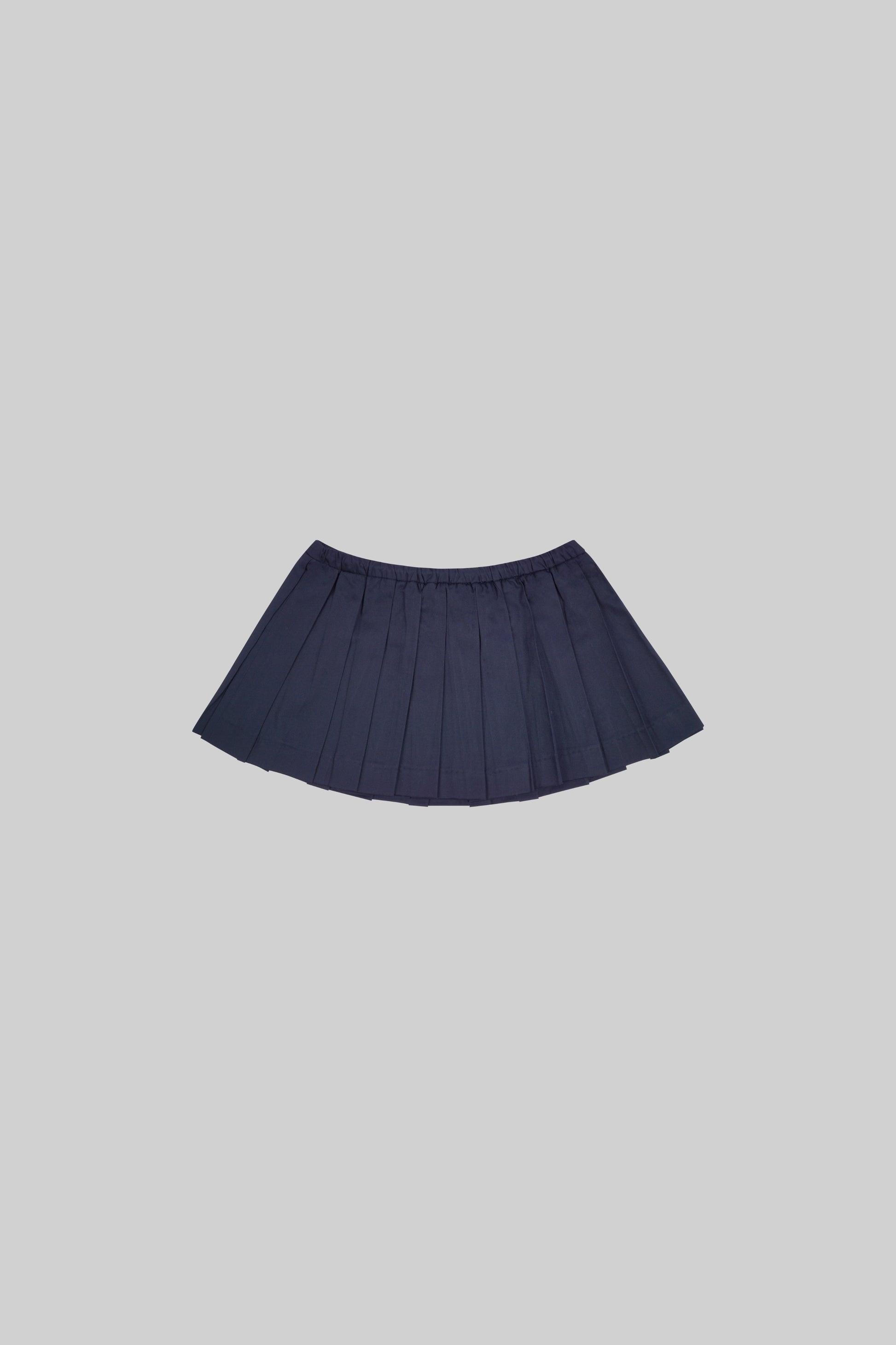 Bross Before HOS Boutique skirt with a stylish plate detail, shown in a close-up view highlighting the fabric and design features.