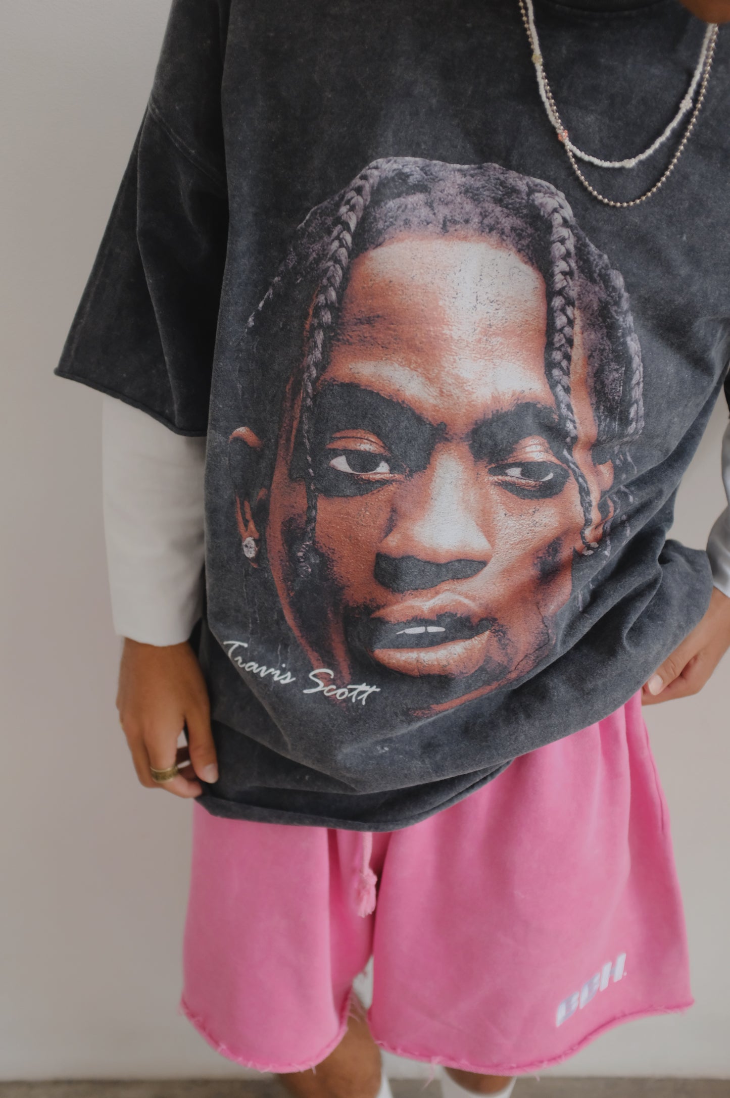 Black Travis Scott print T-shirt from Bross Before Hos Boutique, featuring bold graphic design and casual fit.