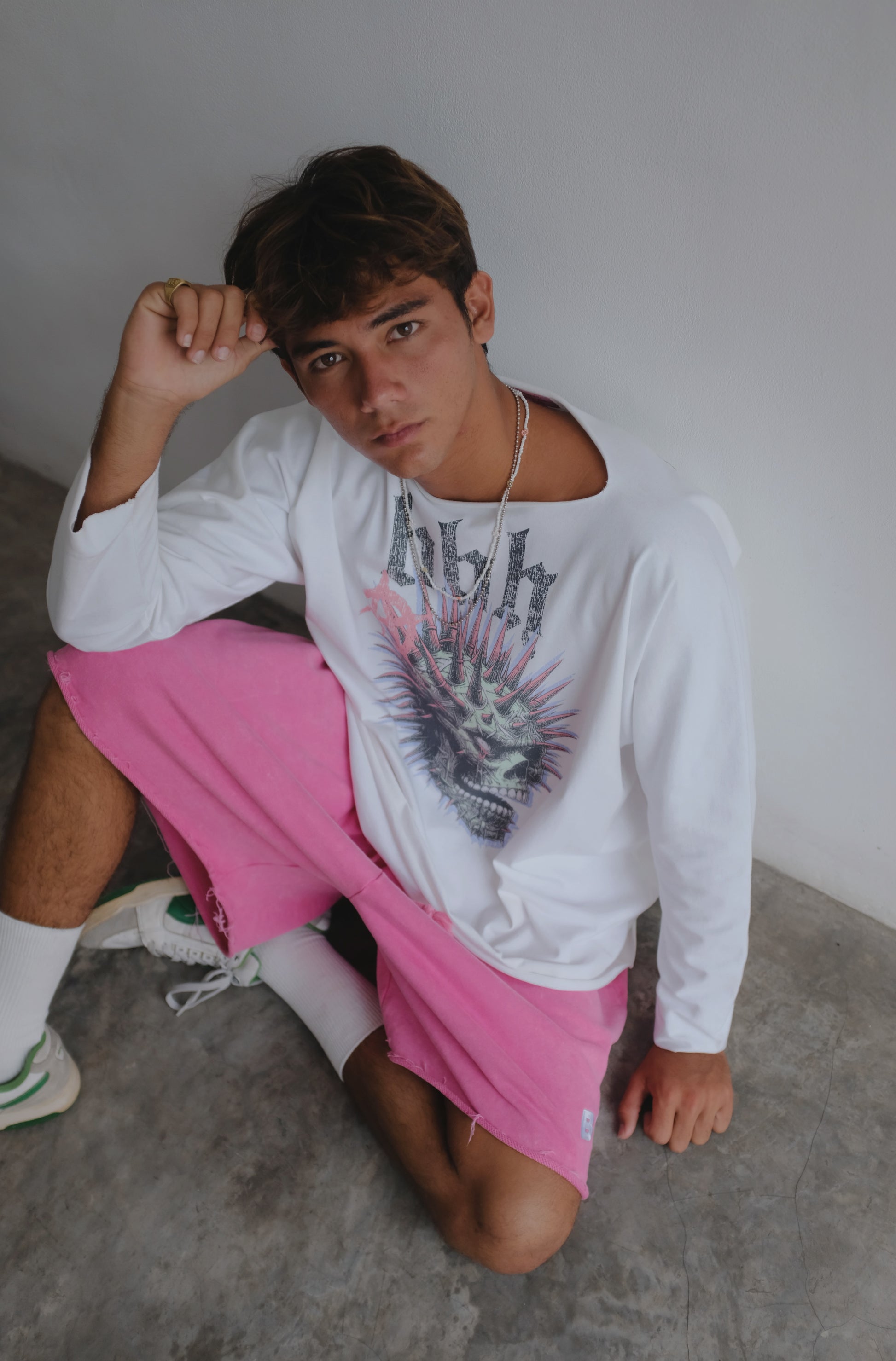 White long-sleeve T-shirt with skull print from Bross Before HOS Boutique, featuring a bold skull graphic on the front.