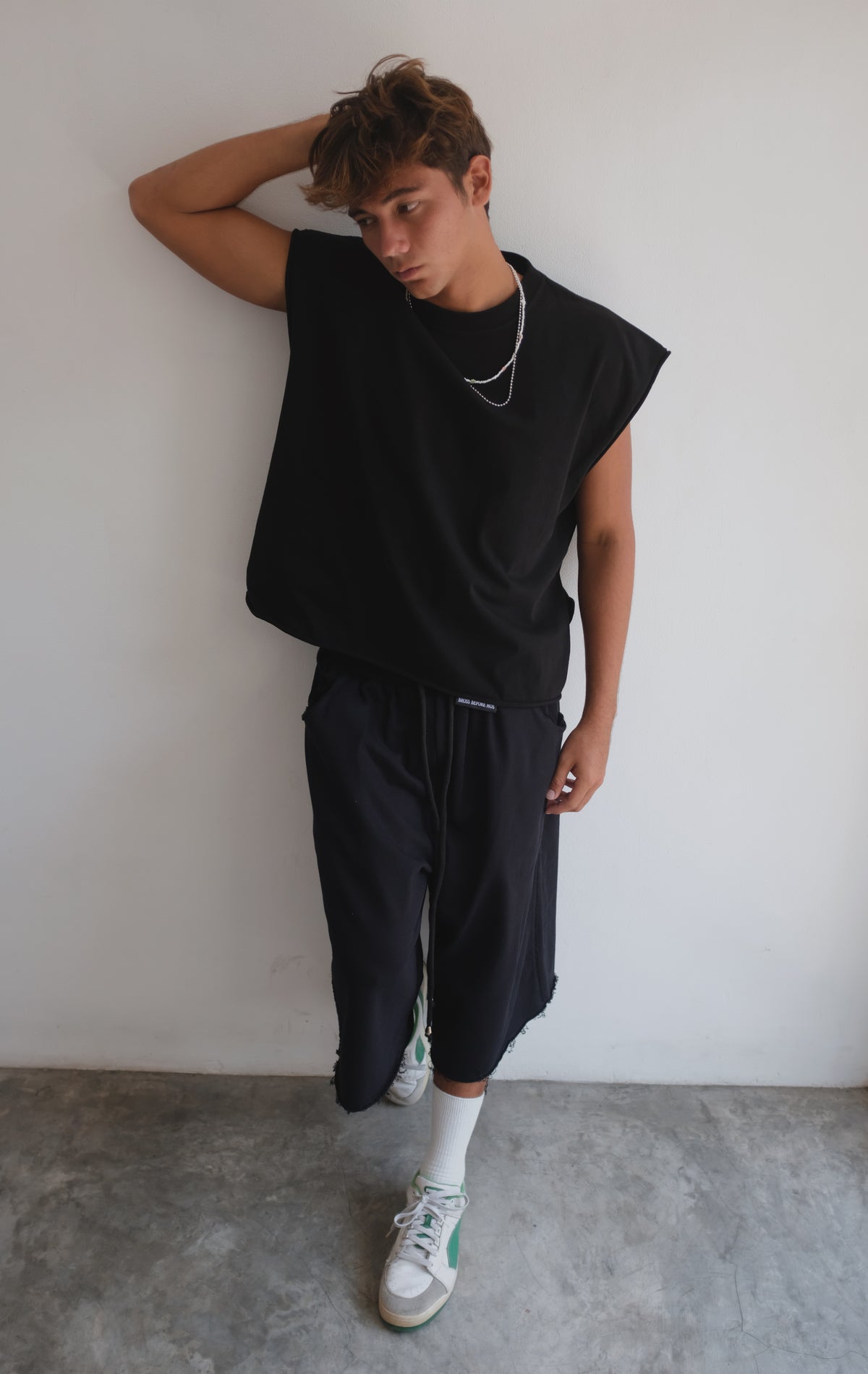 Black BROSS BEFORE HOS BOUTIQUE muscle top, sleeveless athletic tank with a fitted design, ideal for workouts and casual wear.