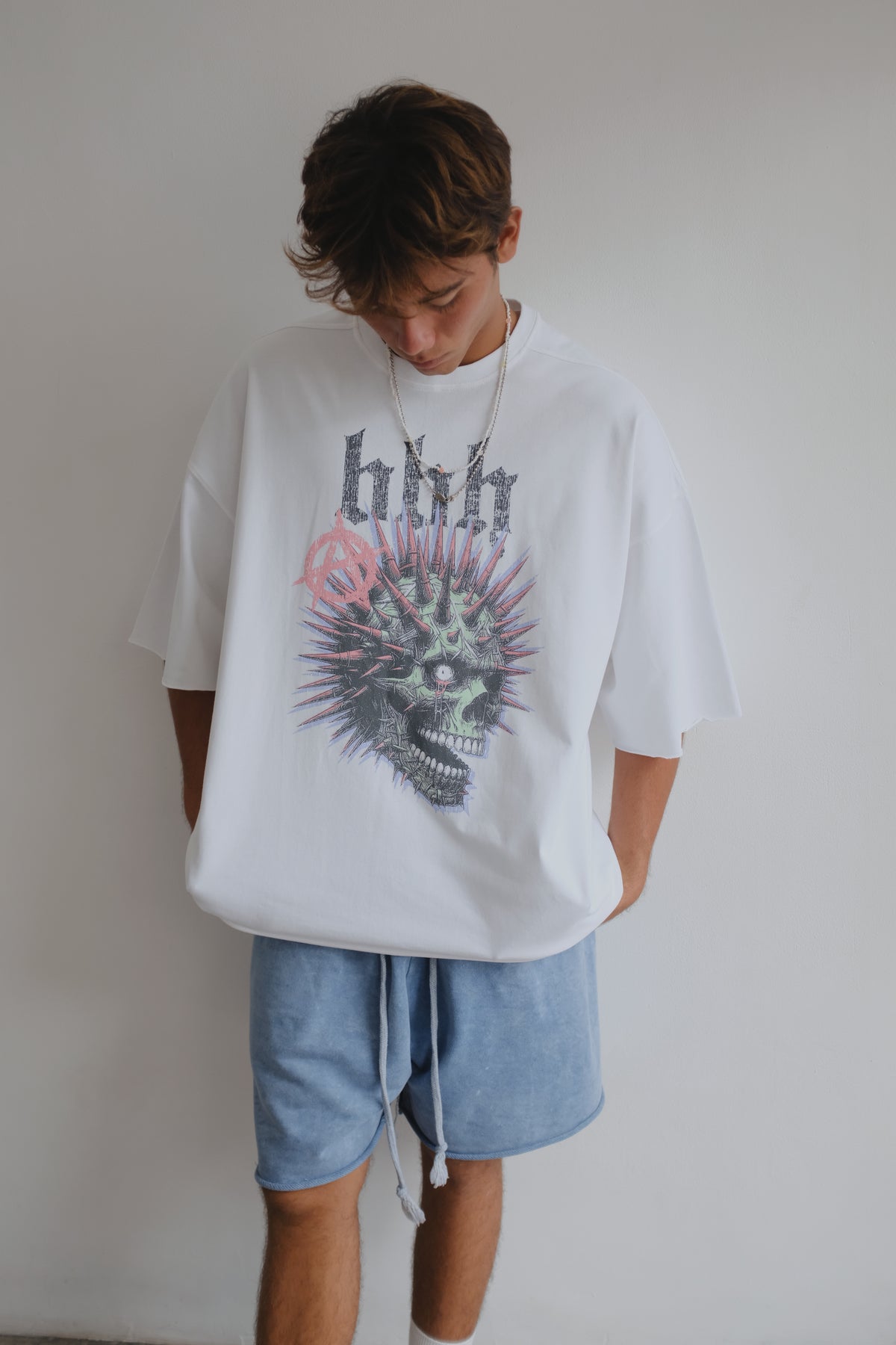 Black Bross Before Hos Boutique T-shirt with white skull print, featuring a casual fit and graphic design.