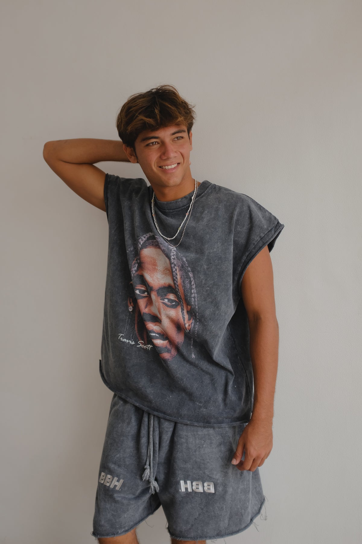 Black muscle top with Travis Scott print from Bross Before Hos Boutique, featuring bold graphic design on a sleeveless style.