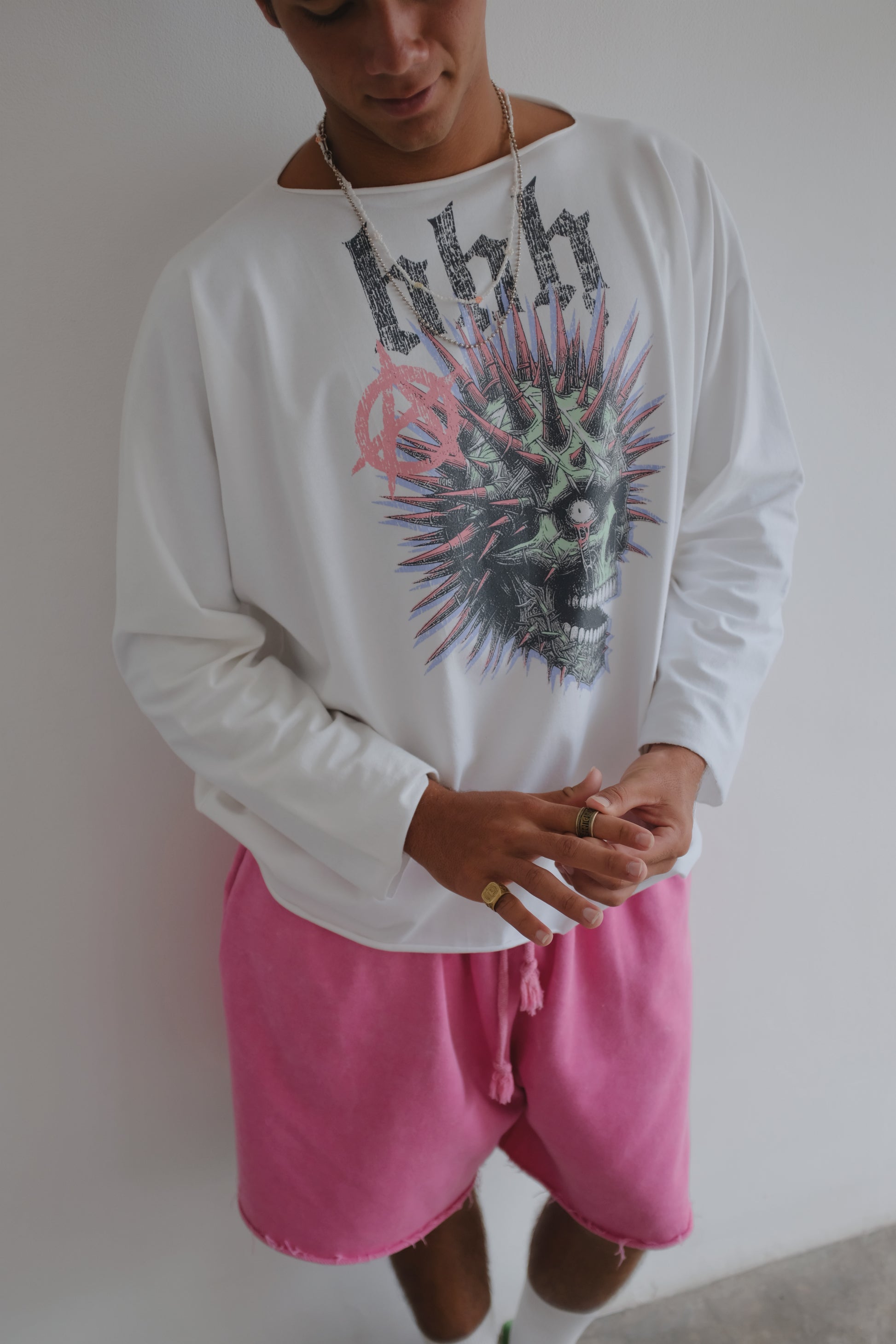 White long-sleeve T-shirt with a skull print from Bross Before Hos Boutique, displayed on a plain background.