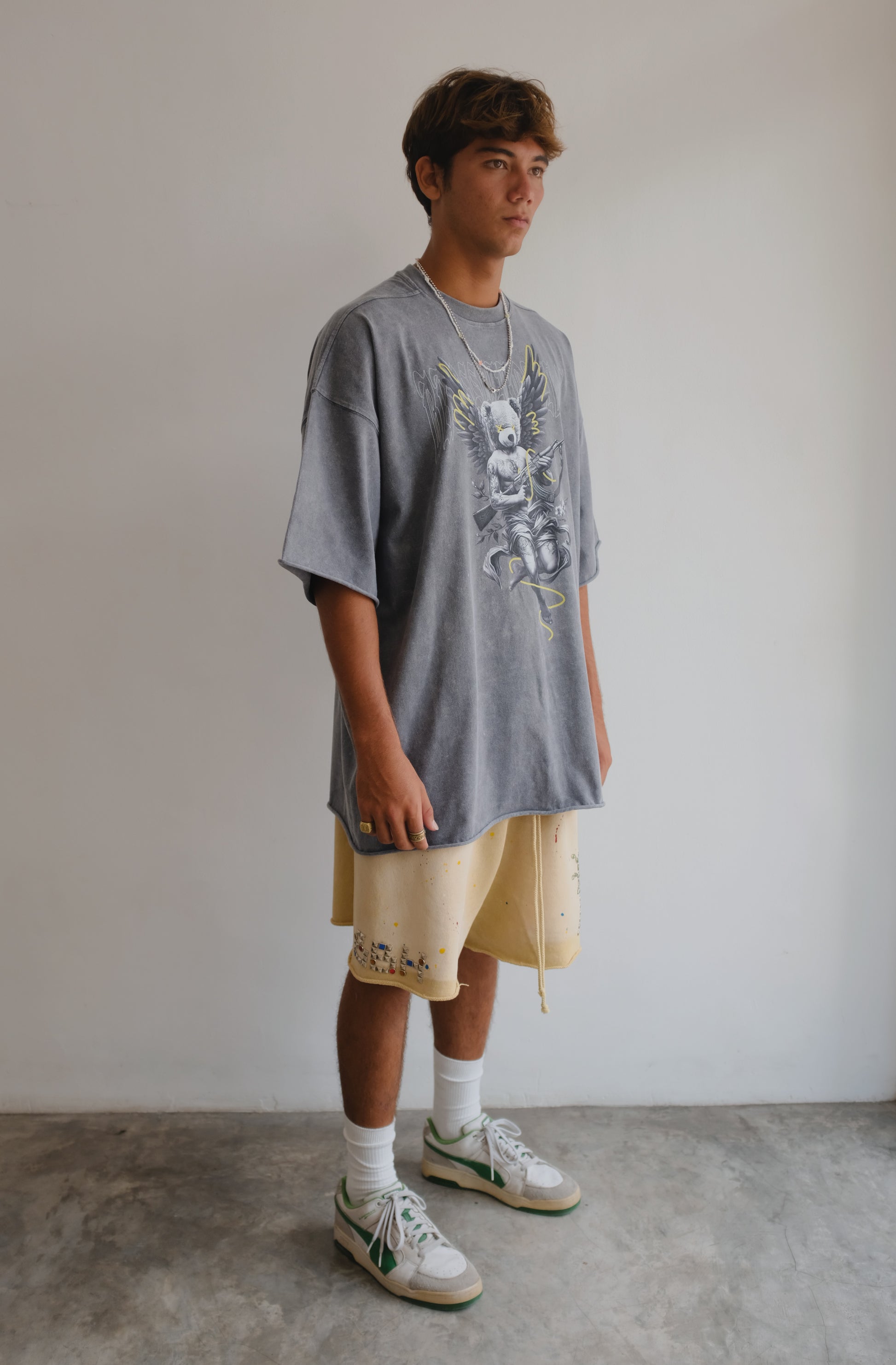 White T-shirt with printed "Angel Bear" design from Bross Before HOS Boutique, featuring a colorful bear illustration on the front.