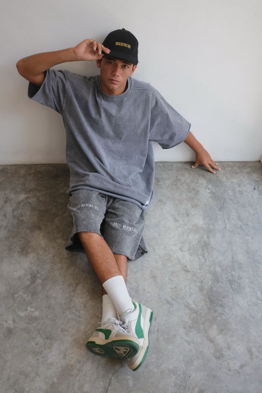 Black stonewashed T-shirt from Bross Before Hos Boutique, showing a relaxed fit with a vintage-inspired design.