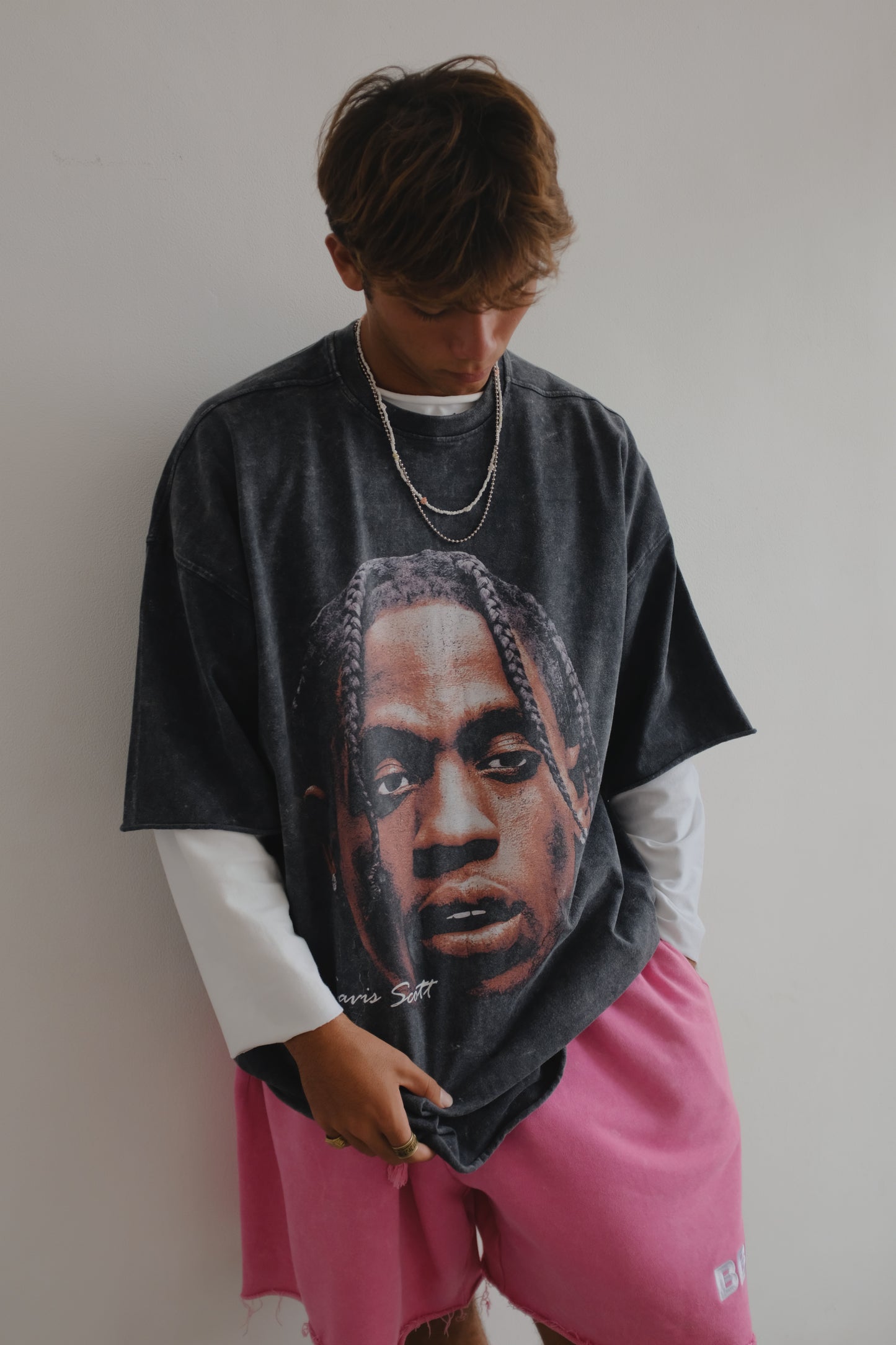Black Travis Scott print T-shirt from Bross Before Hos Boutique, featuring bold graphic artwork on the front.
