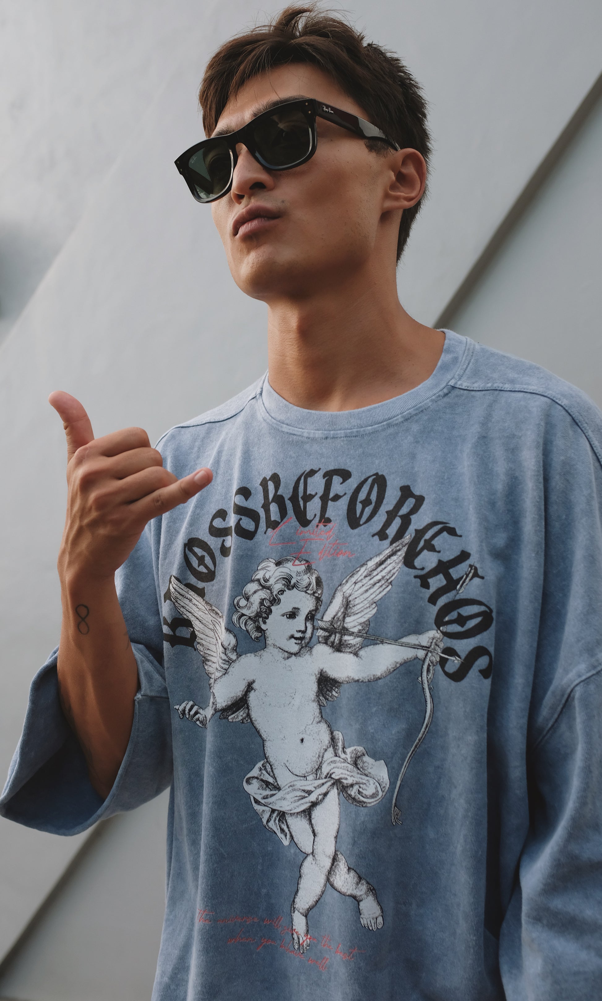 Black BROSS BEFORE HOS BOUTIQUE T-shirt with printed angel design, showcasing a casual fit and artistic graphic on the front.