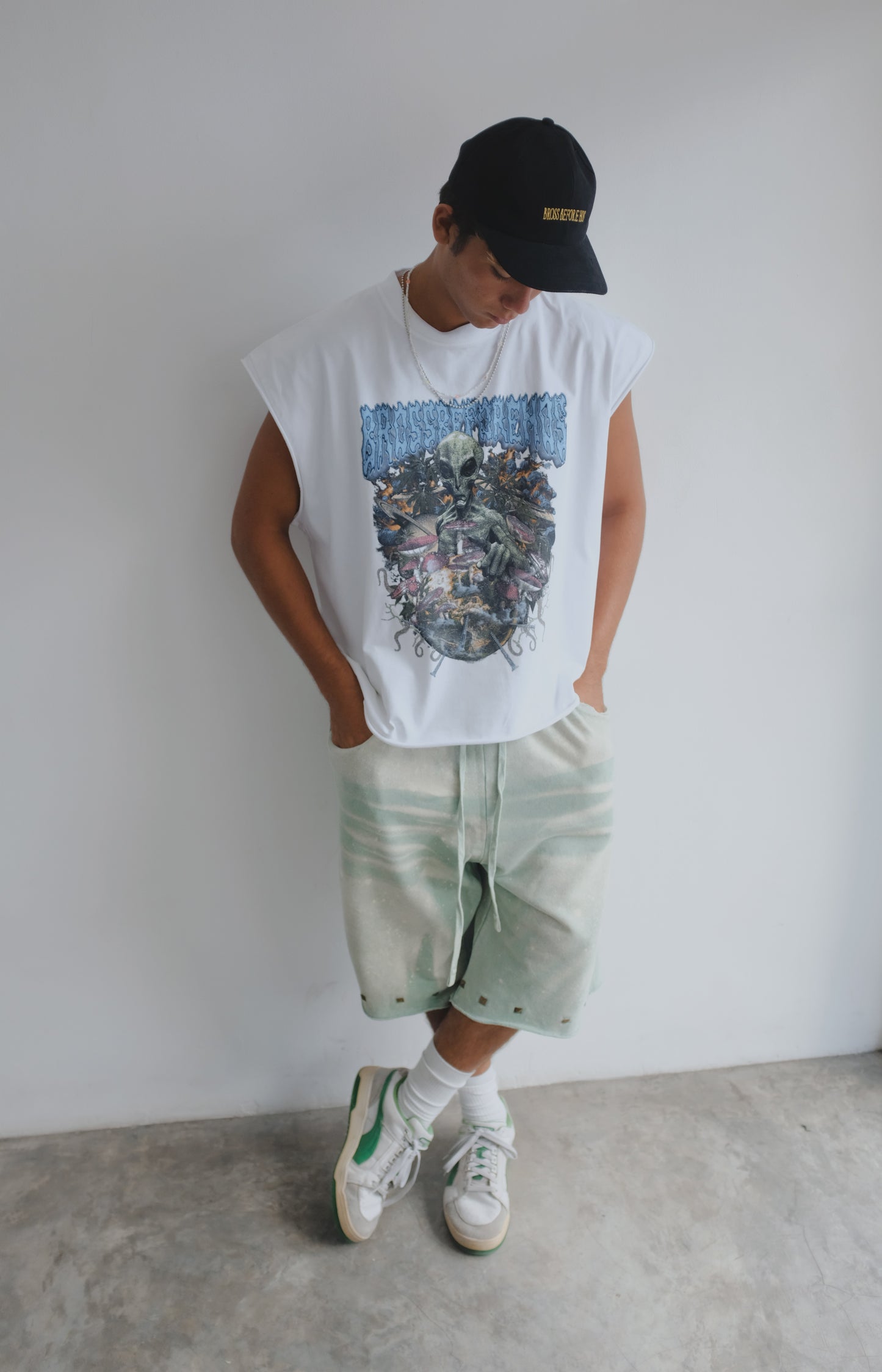 White muscle top with alien print by Bross Before Hos Boutique, featuring a sleeveless design and bold graphic detail.
