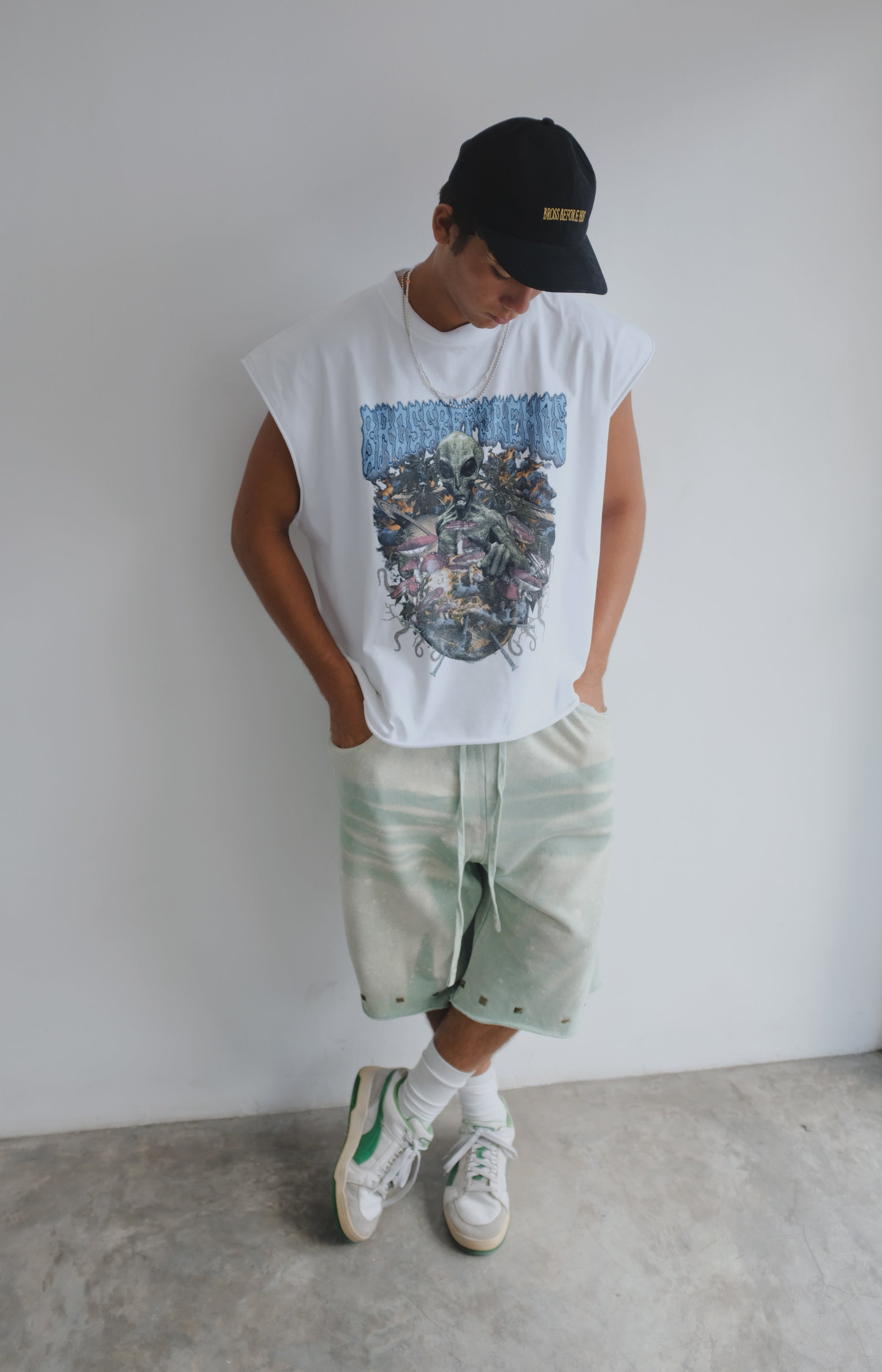 White muscle top with alien print by Bross Before Hos Boutique, featuring a sleeveless design and bold graphic detail.