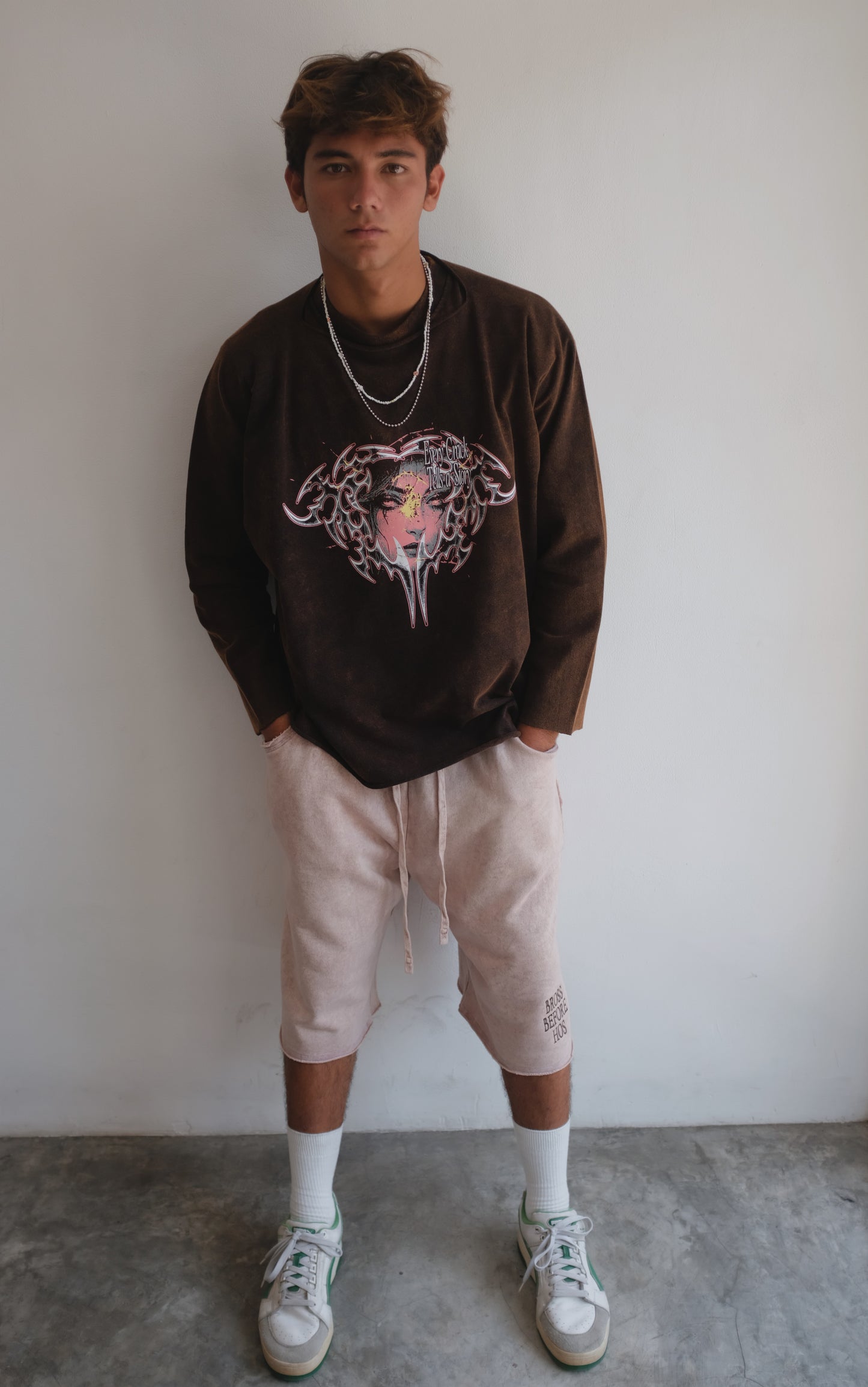 Brown long-sleeve t-shirt with face print from Bross Before Hos Boutique, featuring a casual fit and graphic design.