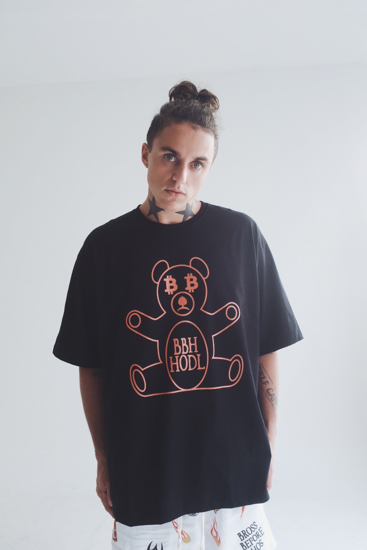 White cotton T-shirt by Bross Before Hos Boutique featuring a Bitcoin bear print on the front.