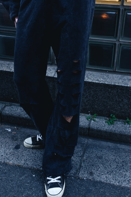 Destroyed stonewashed jersey pants from Bross Before Hos Boutique with a relaxed fit and distressed detailing.