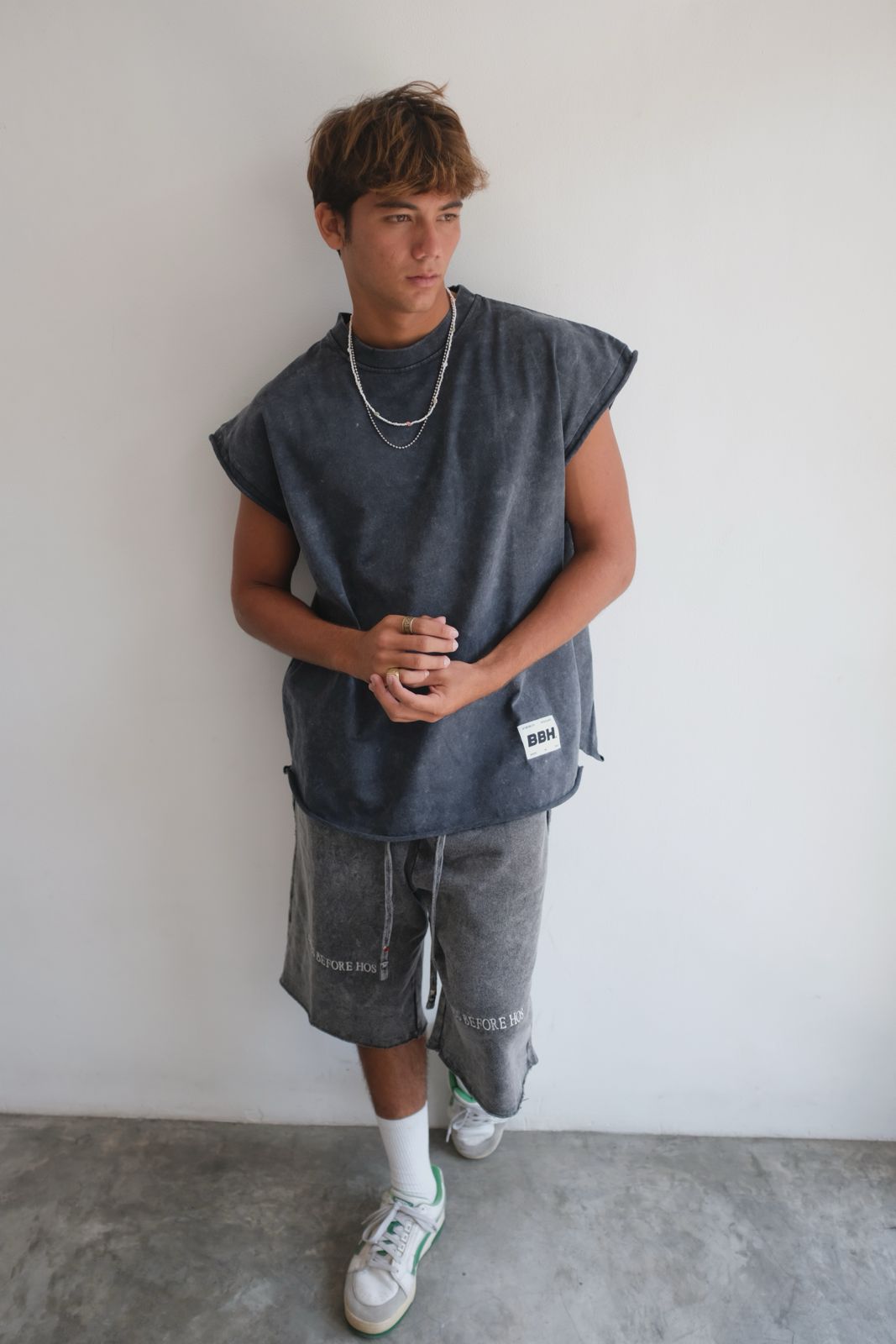 Black muscle top with stonewashed finish from Bross Before H Os Boutique, featuring a fitted sleeveless design and casual style.
