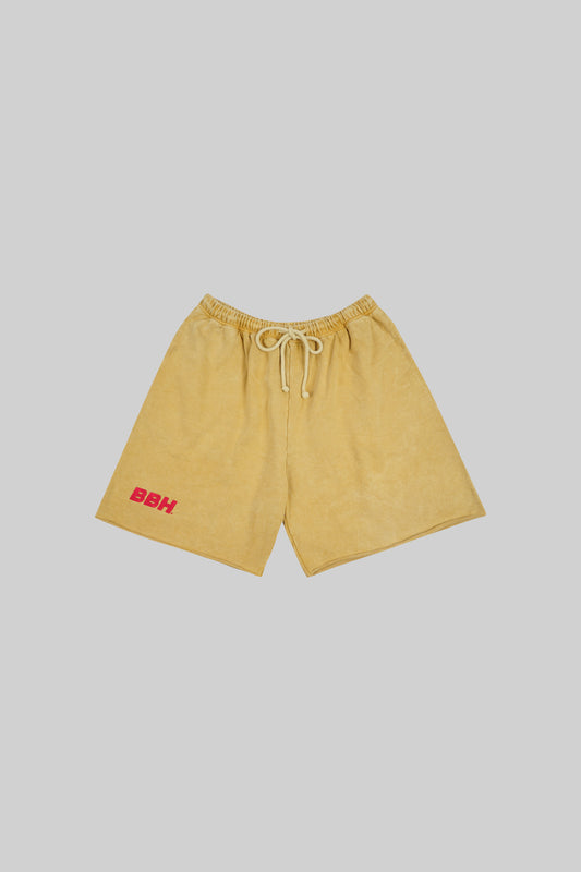 Yellow French terry shorts from Bross Before Hos Boutique featuring a casual fit and comfortable fabric.