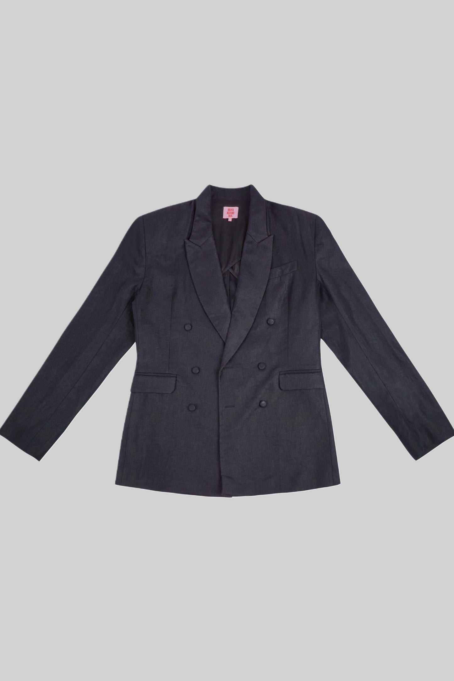 Black linen jacket from Bross Before Hos Boutique, shown on a hanger with close-up fabric texture and stylish design details.