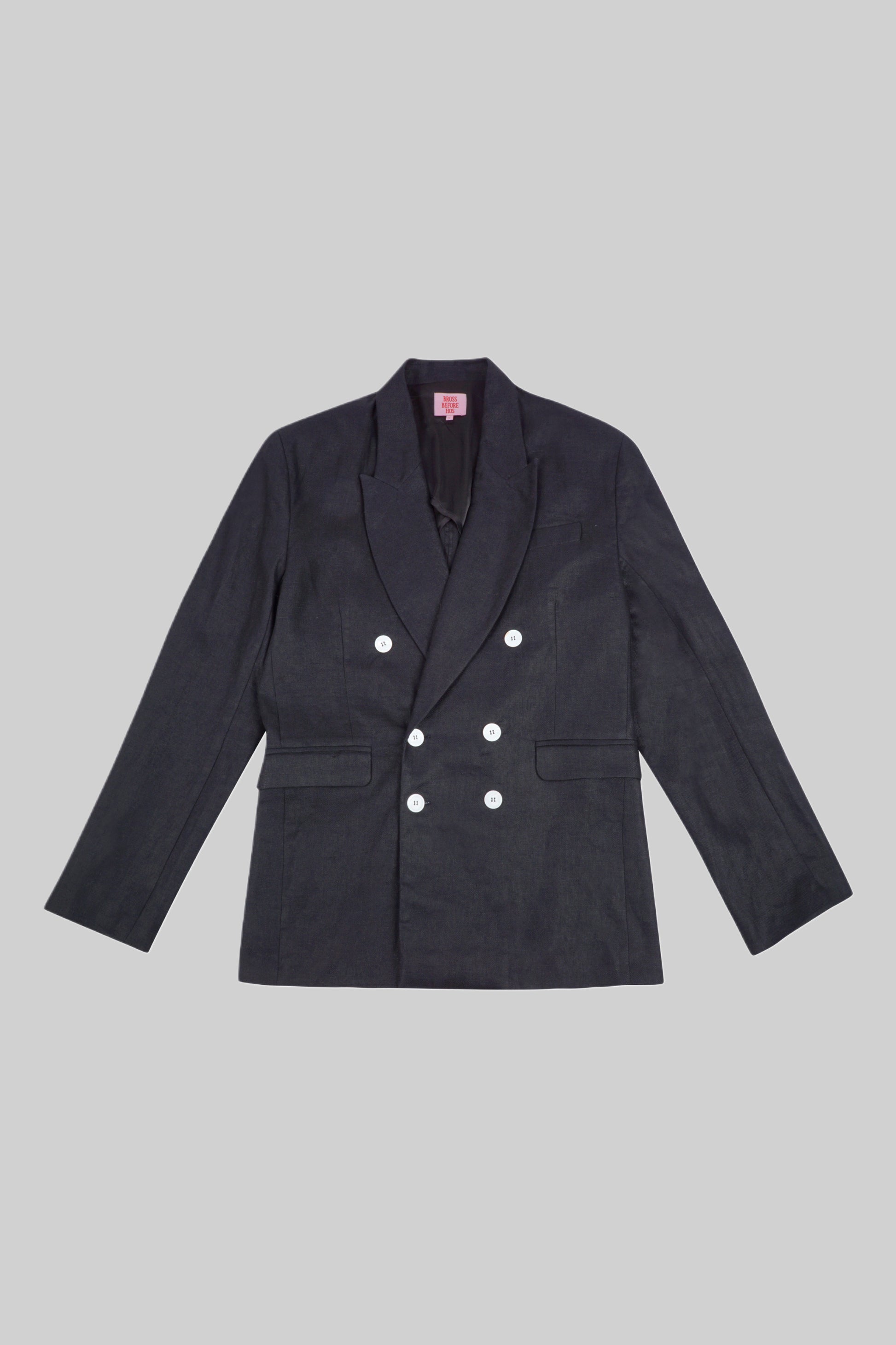 Black linen jacket from Bross Before H Os Boutique, shown on a hanger with a relaxed fit and lightweight fabric.
