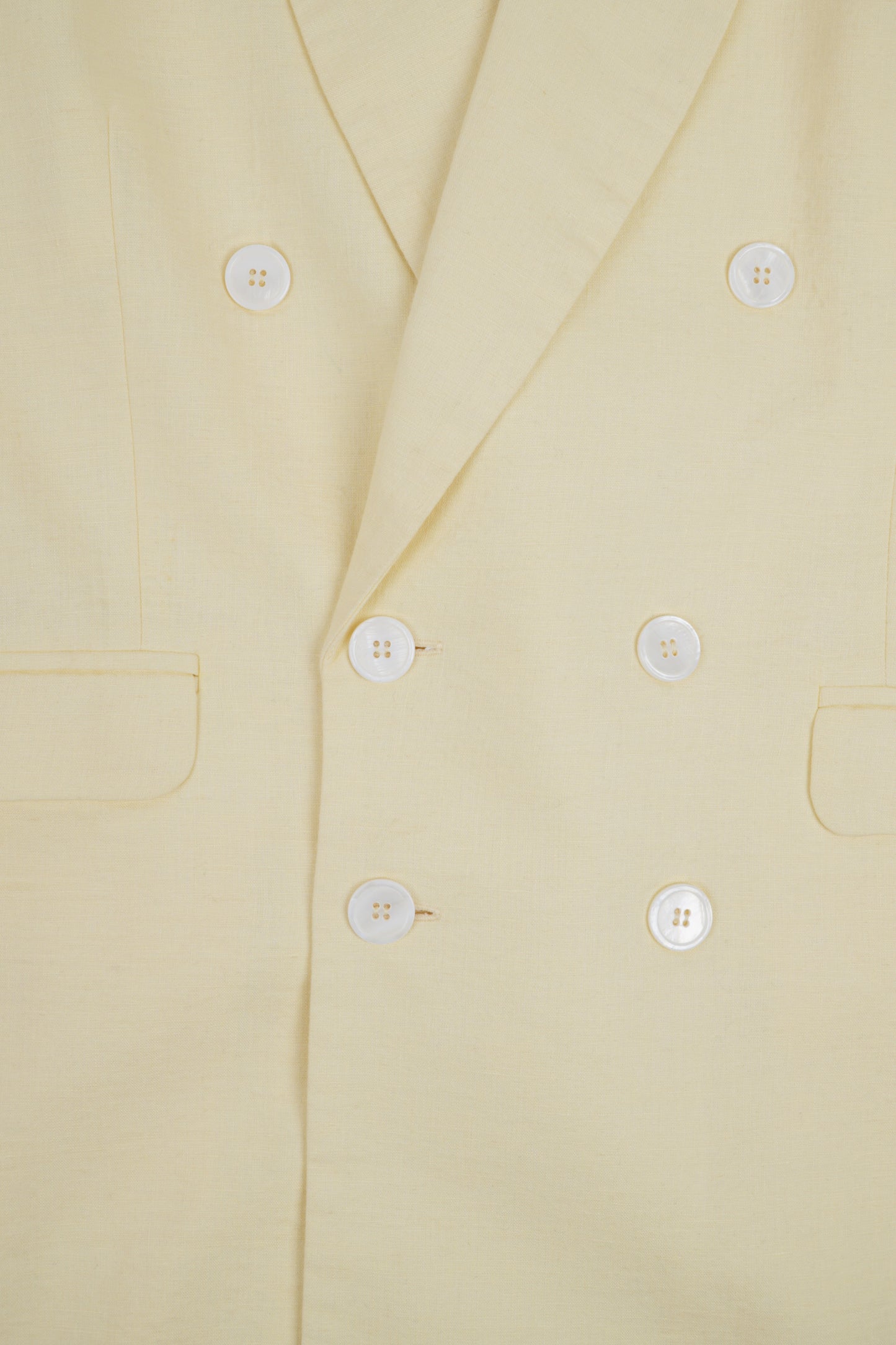 Light beige linen jacket from Sun Pressed by Bross Before HOS Boutique, shown on a hanger with a relaxed fit.