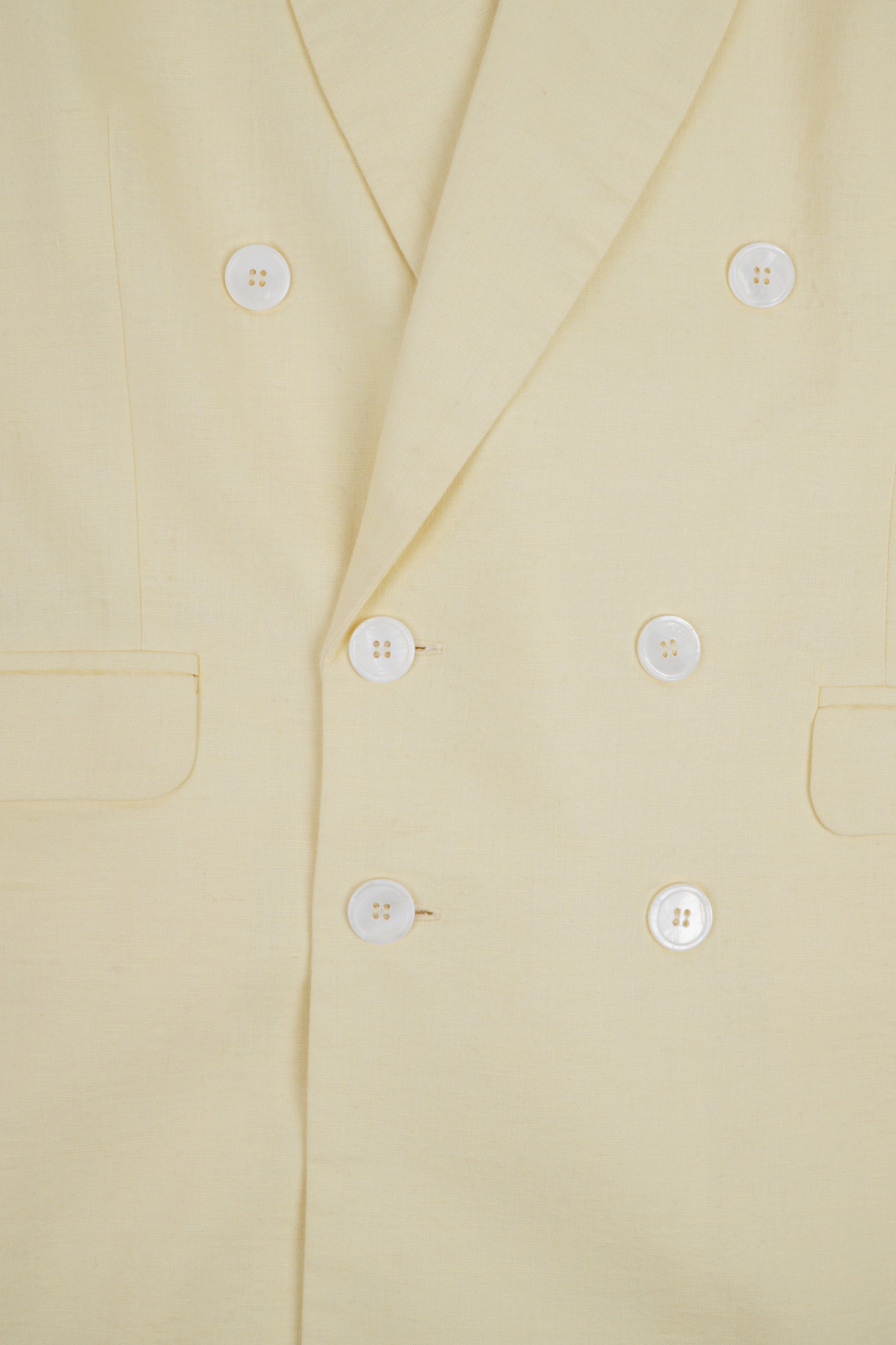 Light beige linen jacket from Sun Pressed by Bross Before HOS Boutique, shown on a hanger with a relaxed fit.