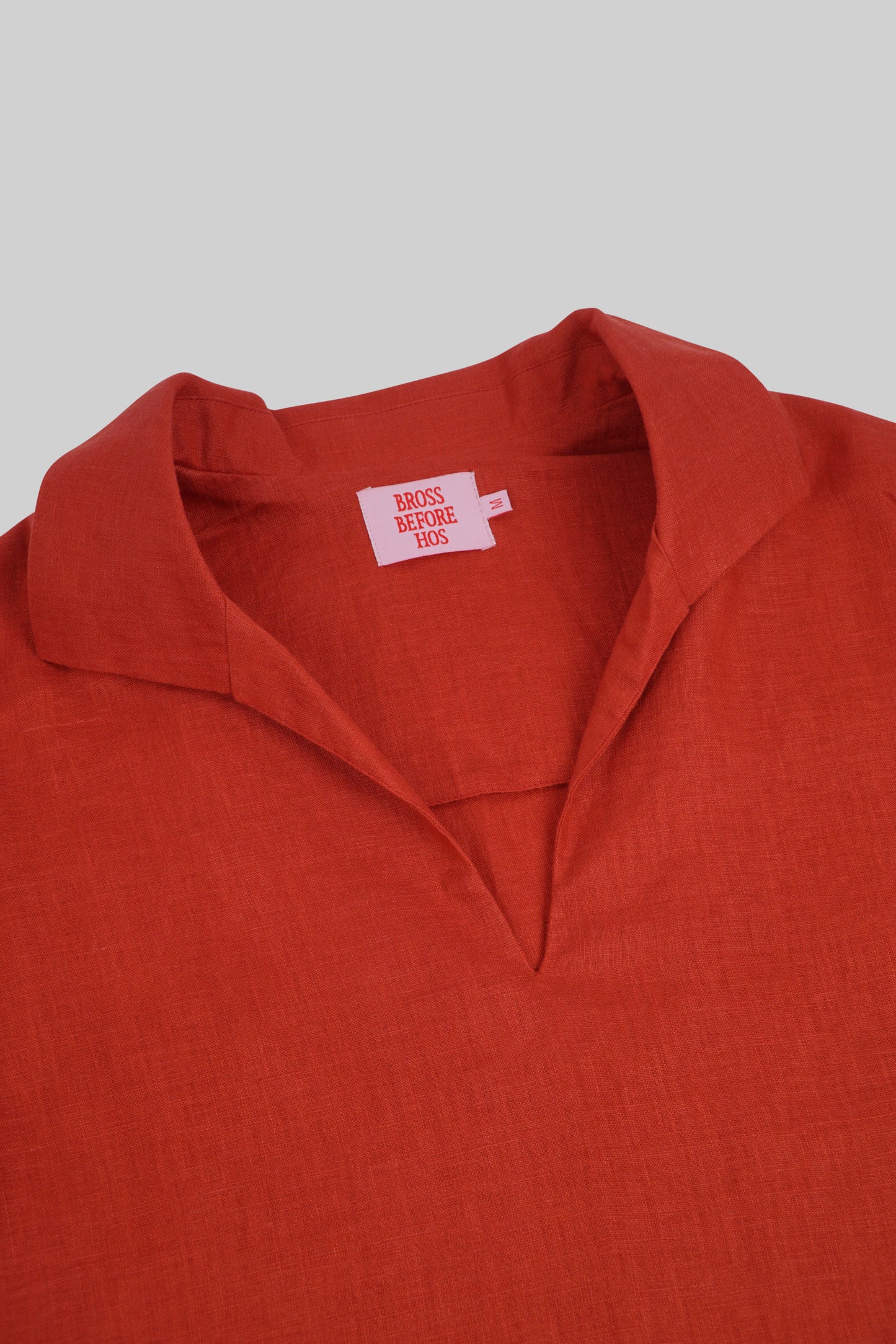Red Ramie short-sleeve shirt from Bross Before Hos Boutique, showing lightweight fabric and casual fit.