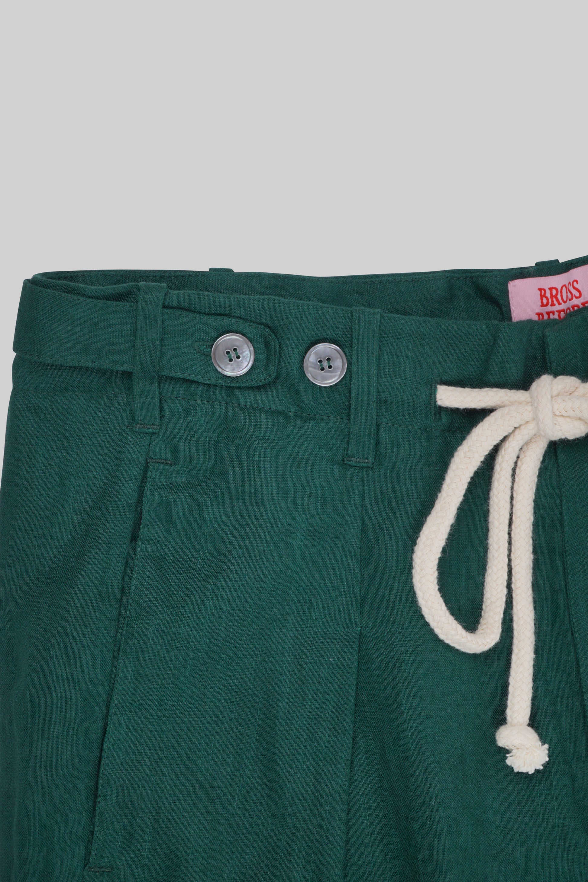 Light beige linen pants from Bross Before HOS Boutique, featuring a relaxed fit and comfortable waistband.
