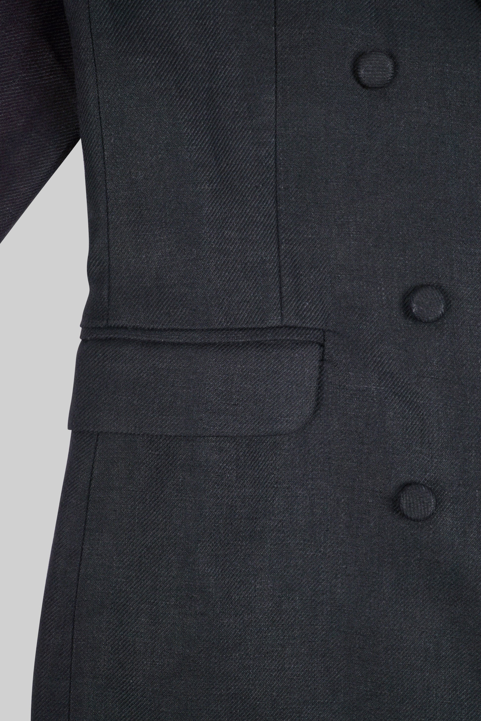 Black linen jacket by Bross Before Hoss Boutique, shown on a hanger with a relaxed, lightweight fabric design.