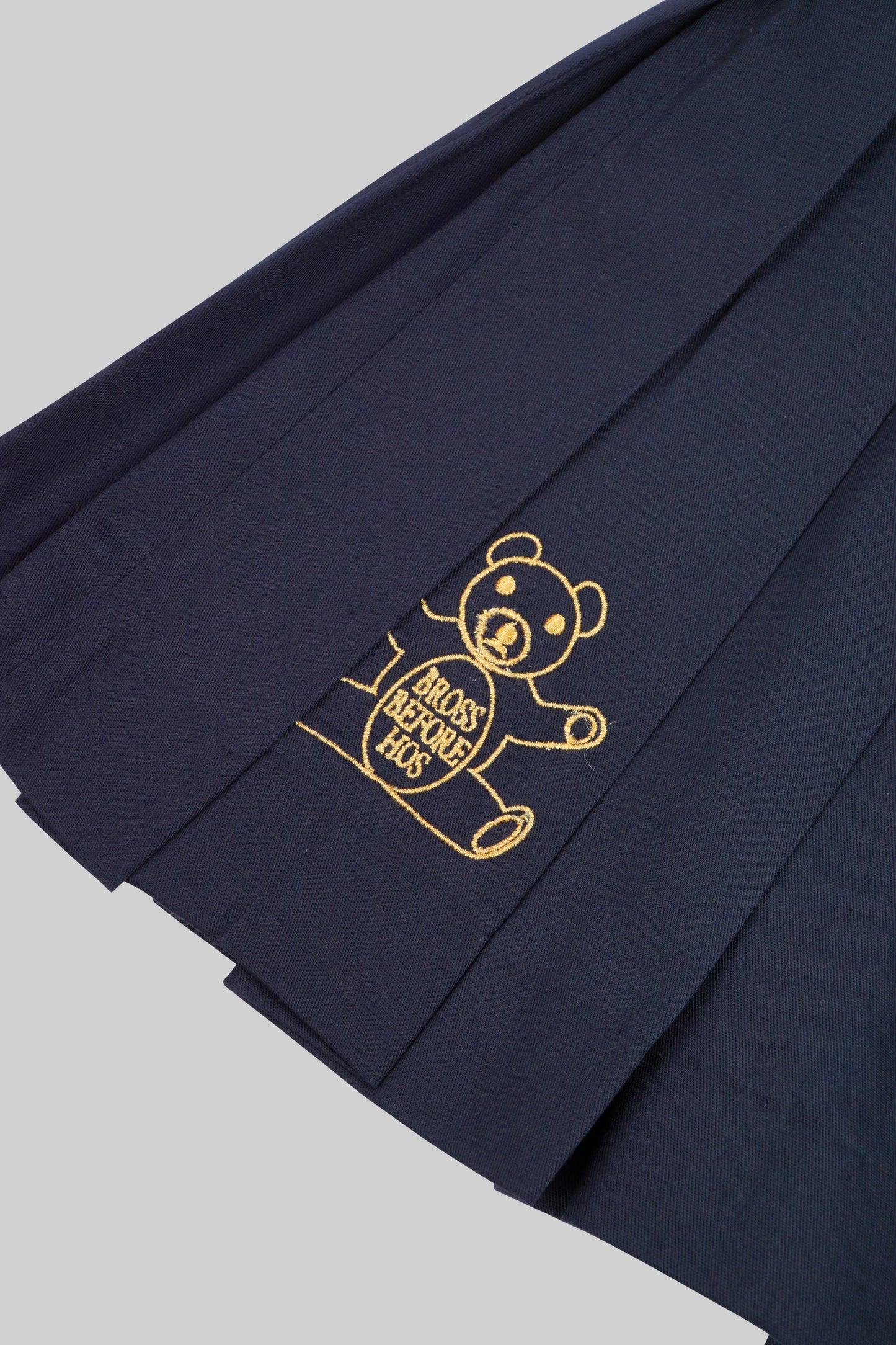 Bross Before HOS Boutique skirt plate, a stylish skirt with decorative plate detail, shown in a close-up image.