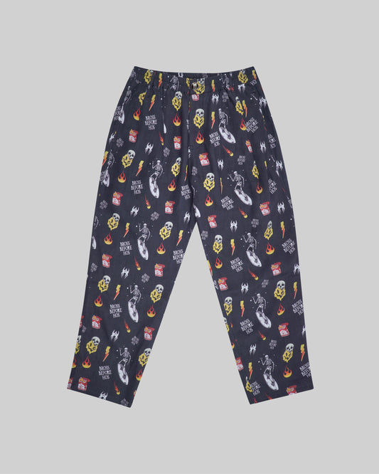 Black relaxed fit linen printed pants from Bross Before Hoss Boutique, shown with comfortable, stylish design and lightweight fabric.
