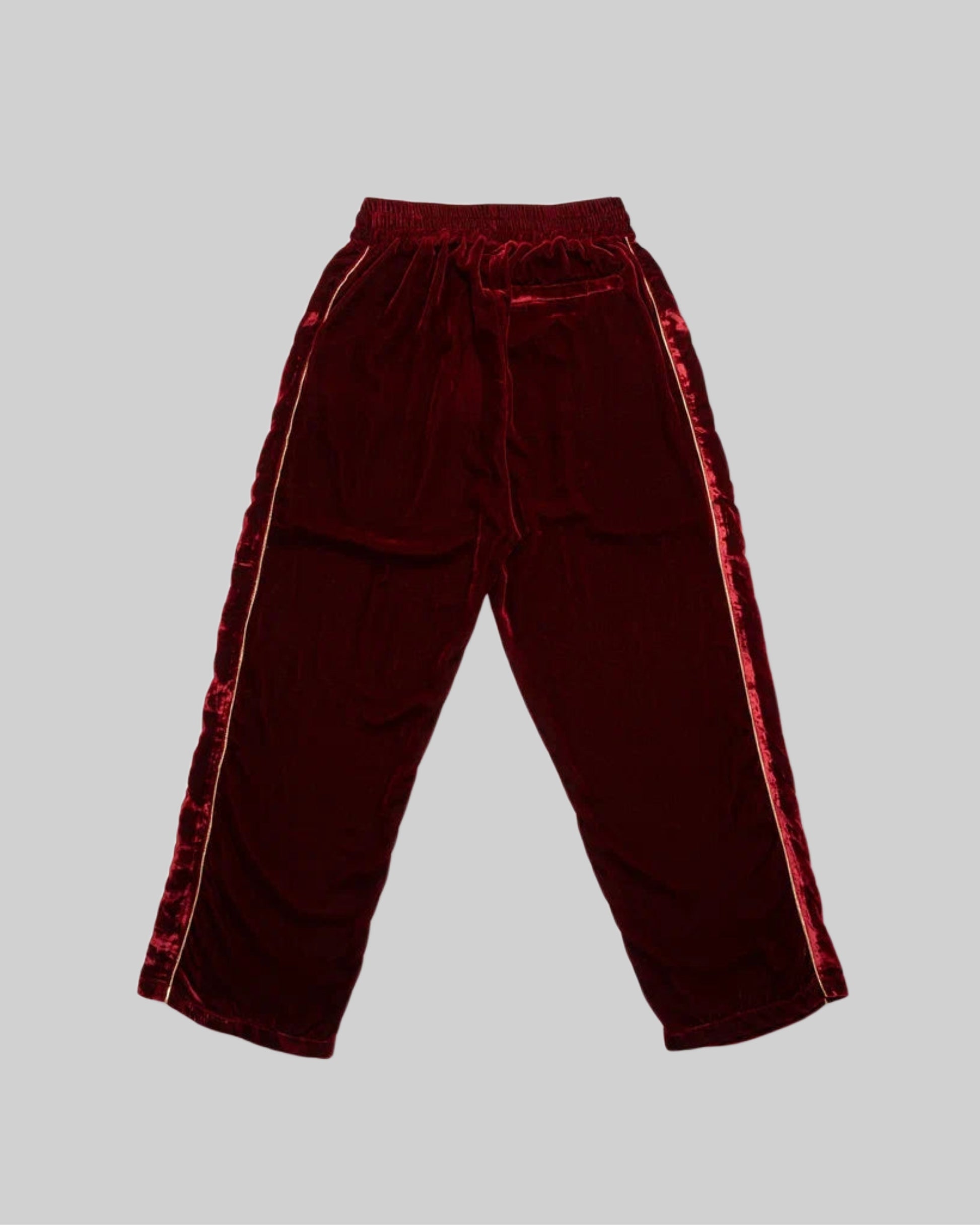 Red silk velvet track pants from Bross Before HOS Boutique, featuring a relaxed fit and stylish design.